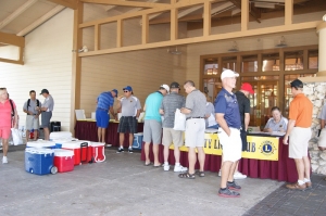 Golfers registering and grabbing a snack 
