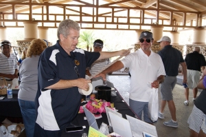 Lion Frank Cummings distributing raffle tickets 
