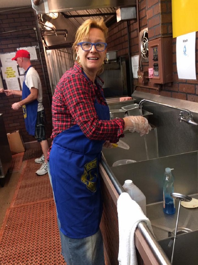 Volunteer Angela Helping In The Lions Food Booth