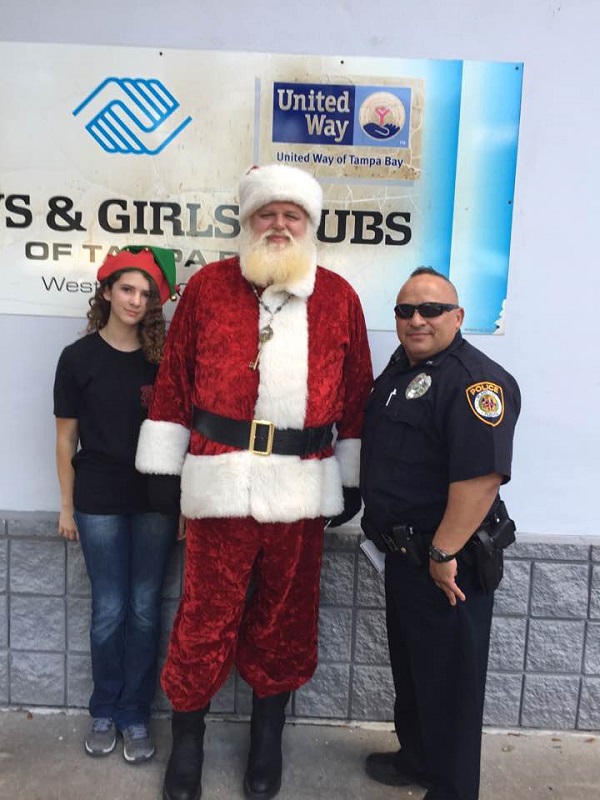 Officer Thomas Velez Poses With Santa & Elf Katelin At The Plant City Boys & Girls Club