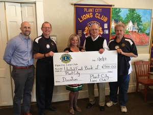 Plant City Lions Club Presents Mary Heysek, Executive Director for the United Food Bank of Plant City w/ A Donation Check 